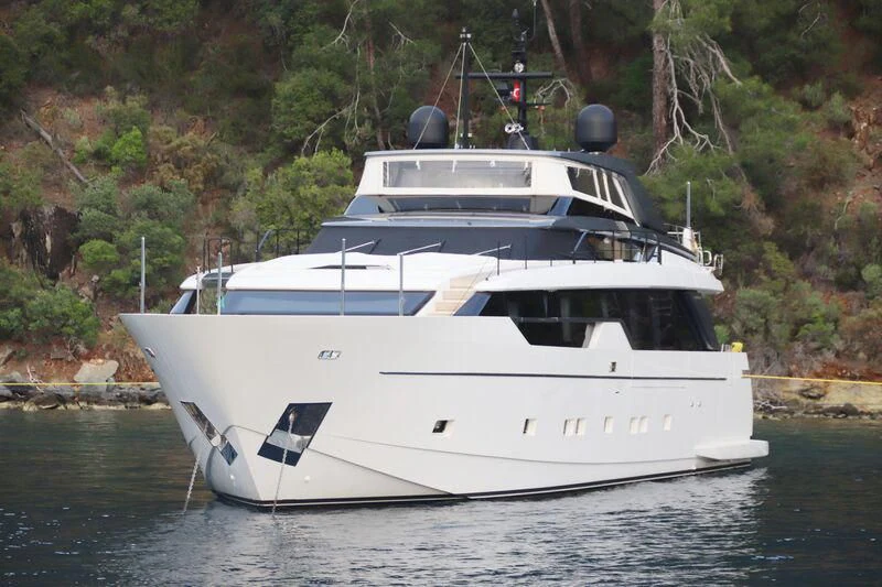 a white boat on water aboard AMWAJ Yacht for Sale