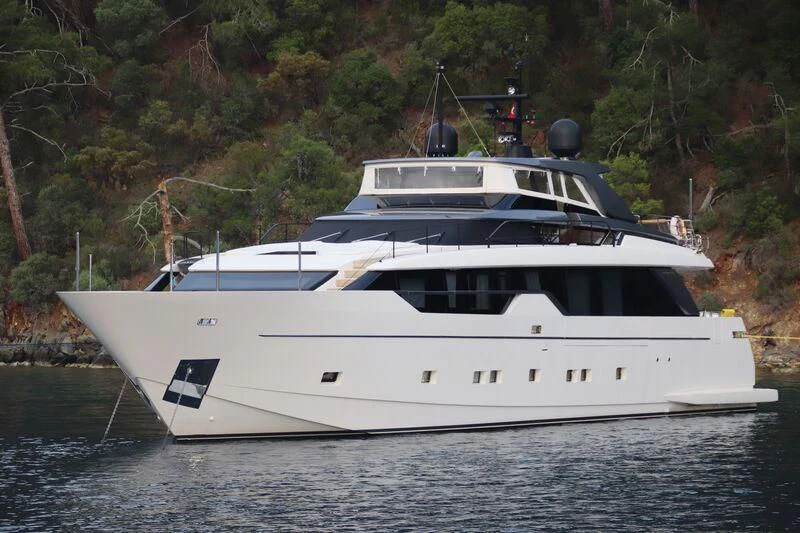 a white yacht in the water aboard AMWAJ Yacht for Sale