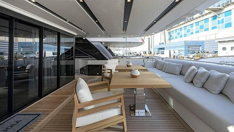 a room with a table and chairs aboard AMWAJ Yacht for Sale