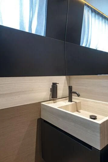 a bathroom with a sink and a mirror aboard AMWAJ Yacht for Sale