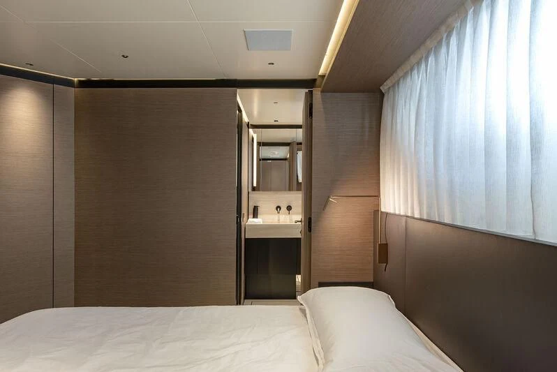 a bed and a sink in a room aboard AMWAJ Yacht for Sale