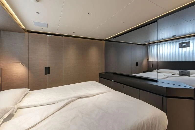 a room with two beds aboard AMWAJ Yacht for Sale