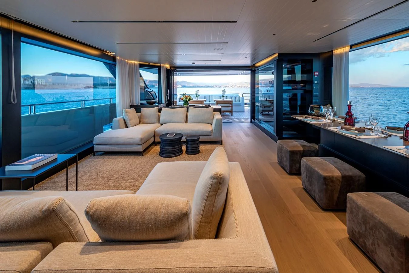 a living room with a large window aboard AMWAJ Yacht for Sale