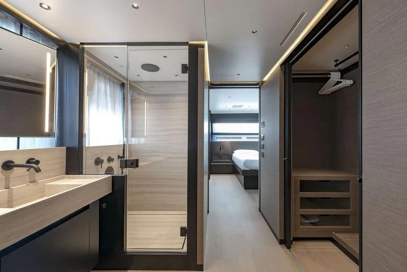 a bathroom with a glass shower aboard AMWAJ Yacht for Sale