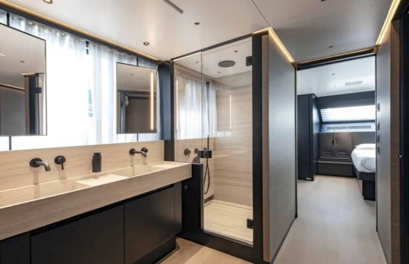 a bathroom with a large mirror aboard AMWAJ Yacht for Sale