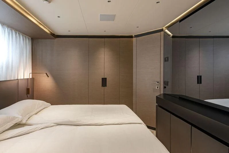 a bed in a room aboard AMWAJ Yacht for Sale
