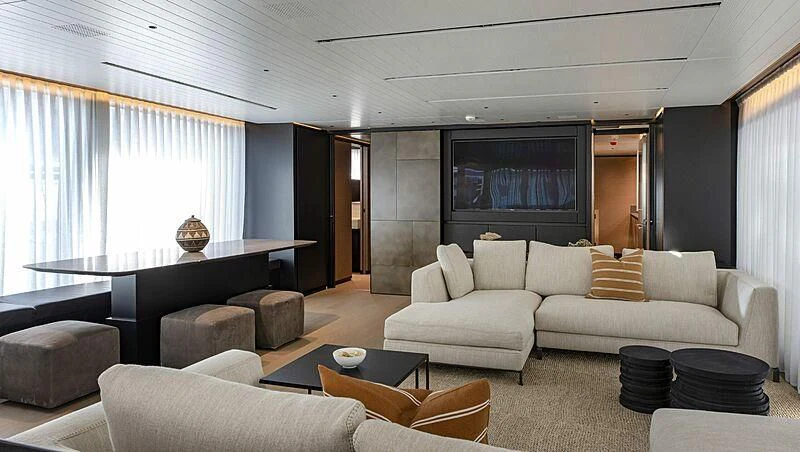 a living room with a large screen aboard AMWAJ Yacht for Sale