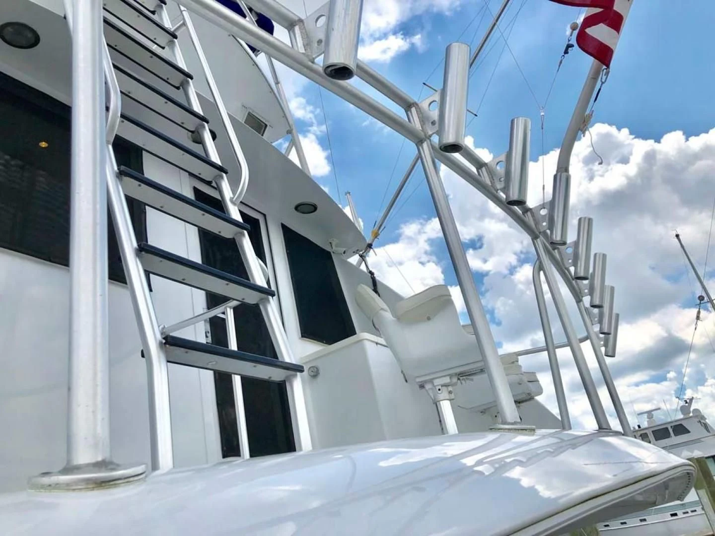 a white building with a flag on it aboard PRIME TIME Yacht for Sale