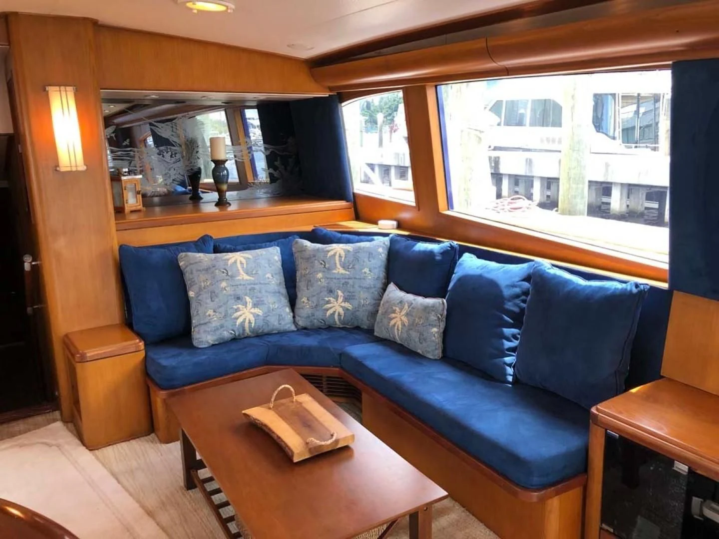 a living room with a blue couch aboard PRIME TIME Yacht for Sale