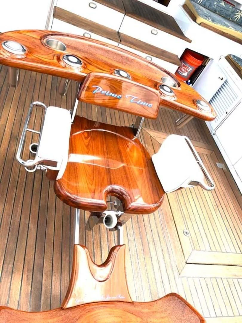 a wooden suitcase on a wooden surface aboard PRIME TIME Yacht for Sale