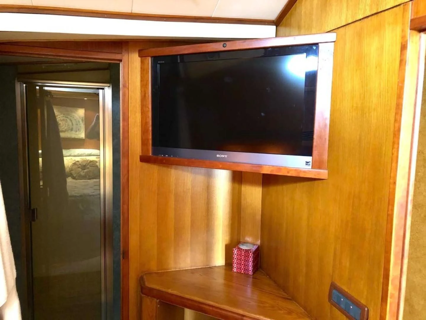 a tv on a wall aboard PRIME TIME Yacht for Sale