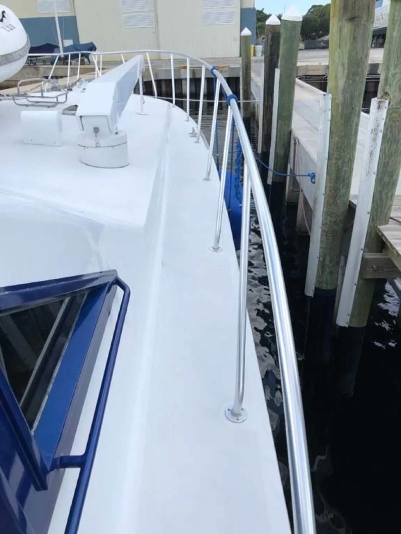 a white table with chairs and a white table with a white table and chairs aboard PRIME TIME Yacht for Sale