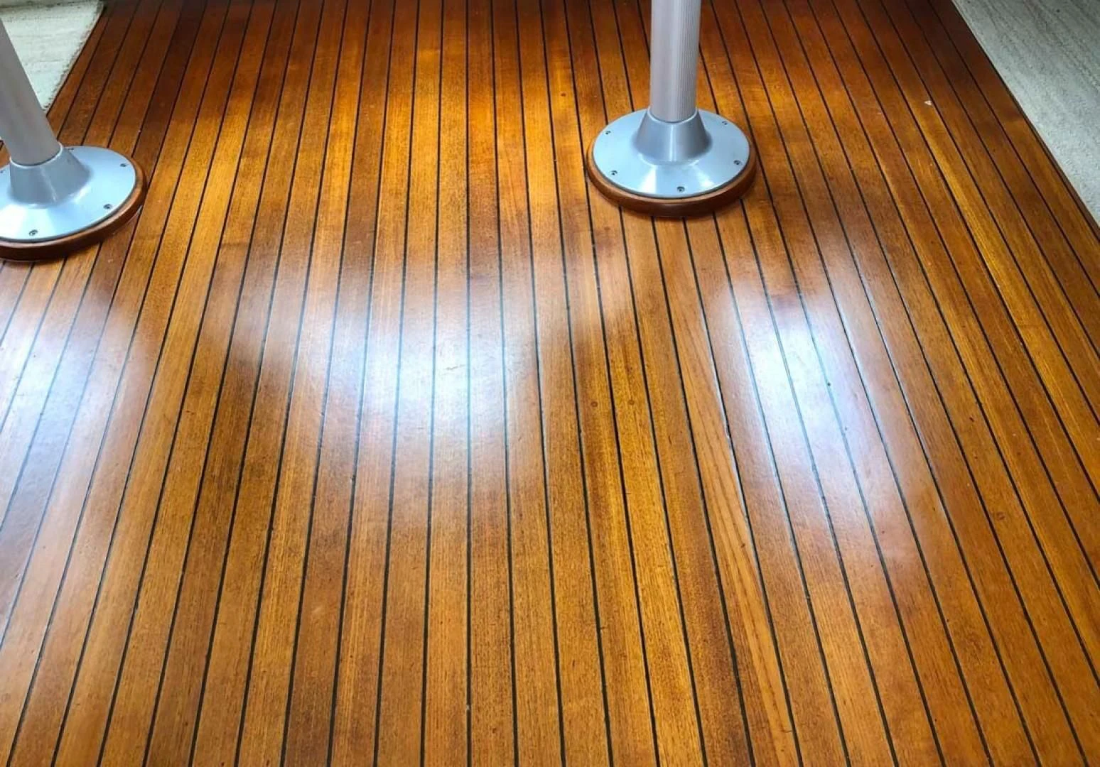 a wood floor with a lamp on it aboard PRIME TIME Yacht for Sale