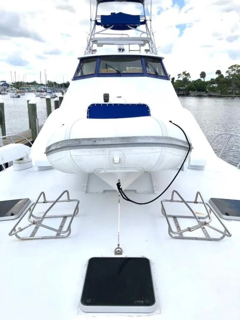 a white yacht docked aboard PRIME TIME Yacht for Sale