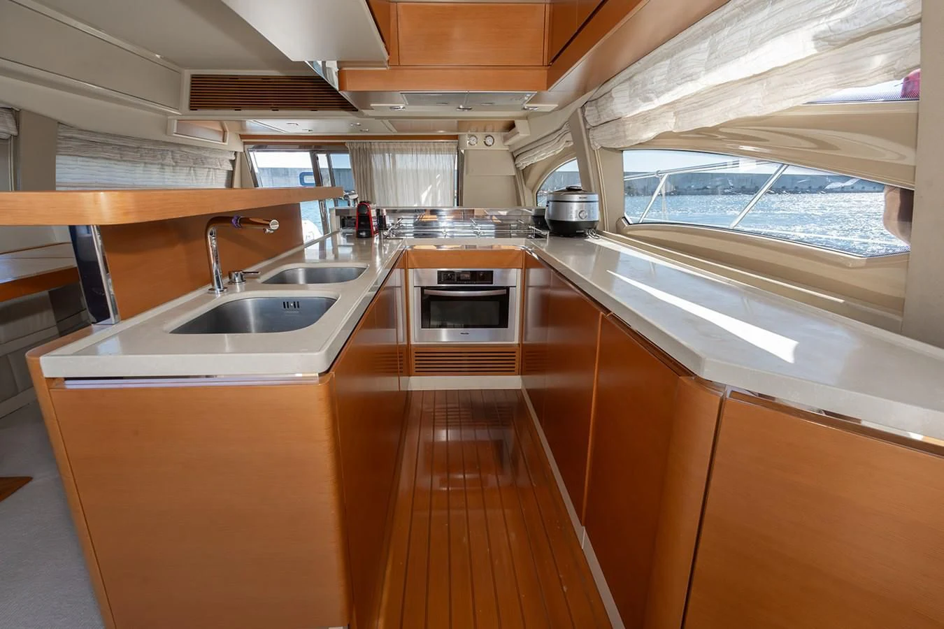 a kitchen with a sink and cabinets aboard ELENA I Yacht for Sale