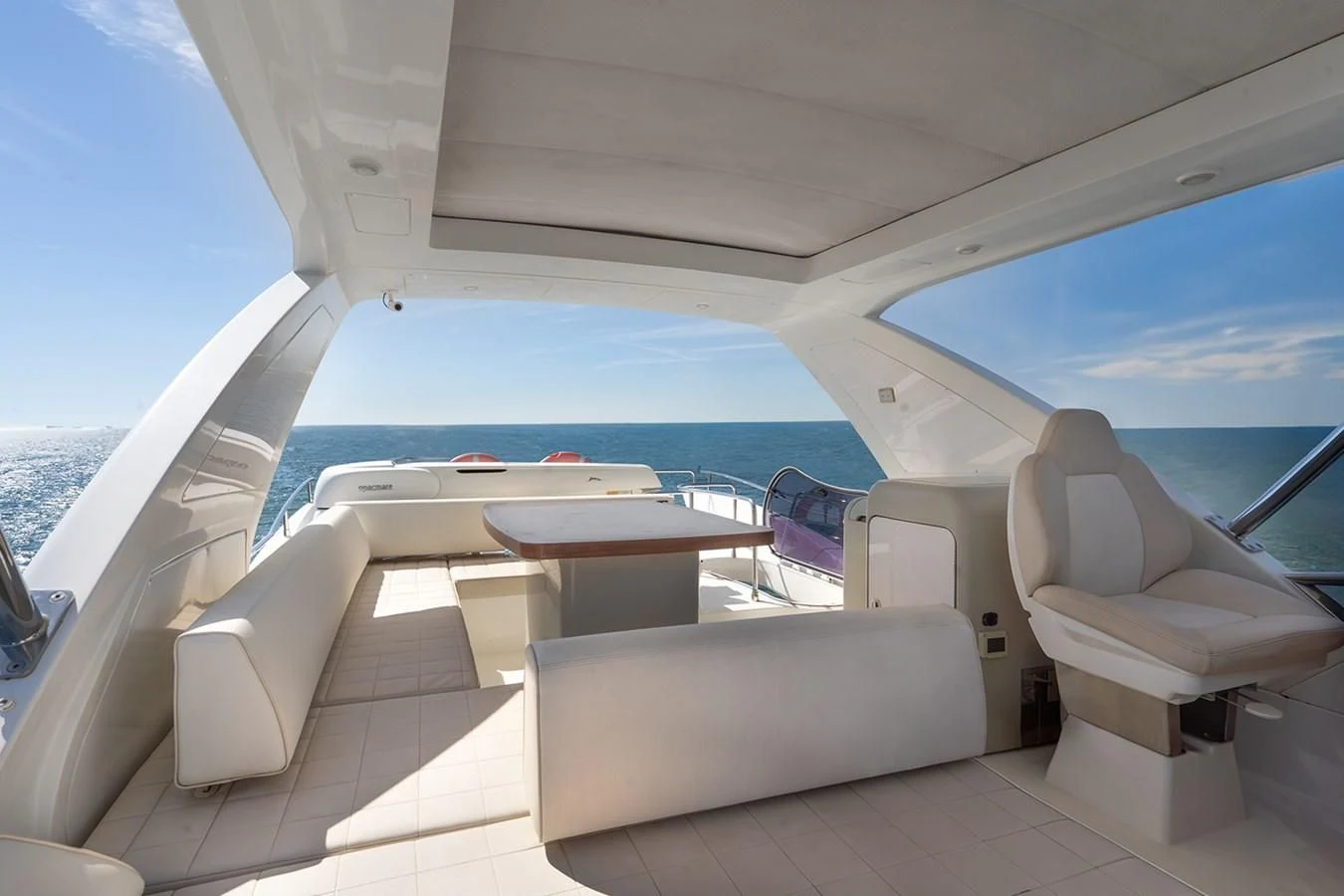 a boat with a table and chairs aboard ELENA I Yacht for Sale