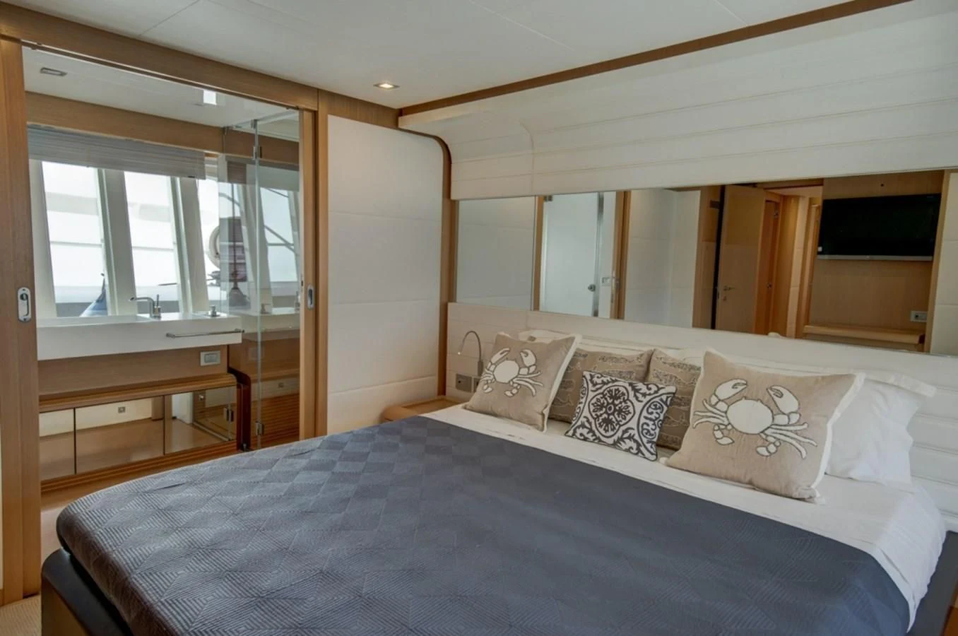 a bed with white sheets aboard GOLDEN BELLE Yacht for Sale