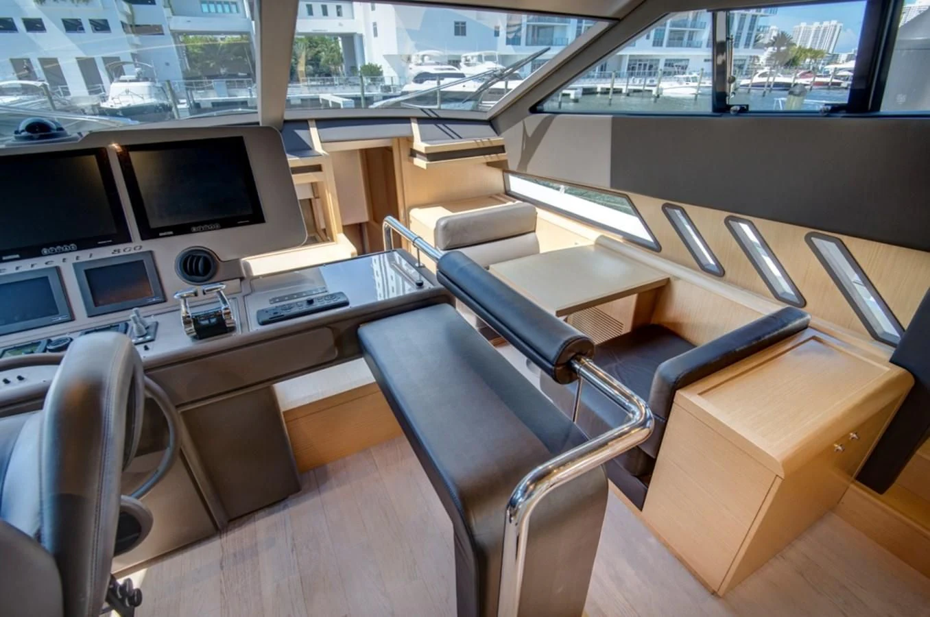 inside of a vehicle with a desk and chairs aboard GOLDEN BELLE Yacht for Sale