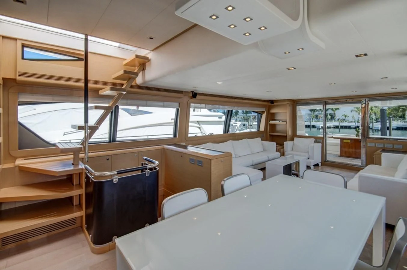 a room with a table and chairs aboard GOLDEN BELLE Yacht for Sale