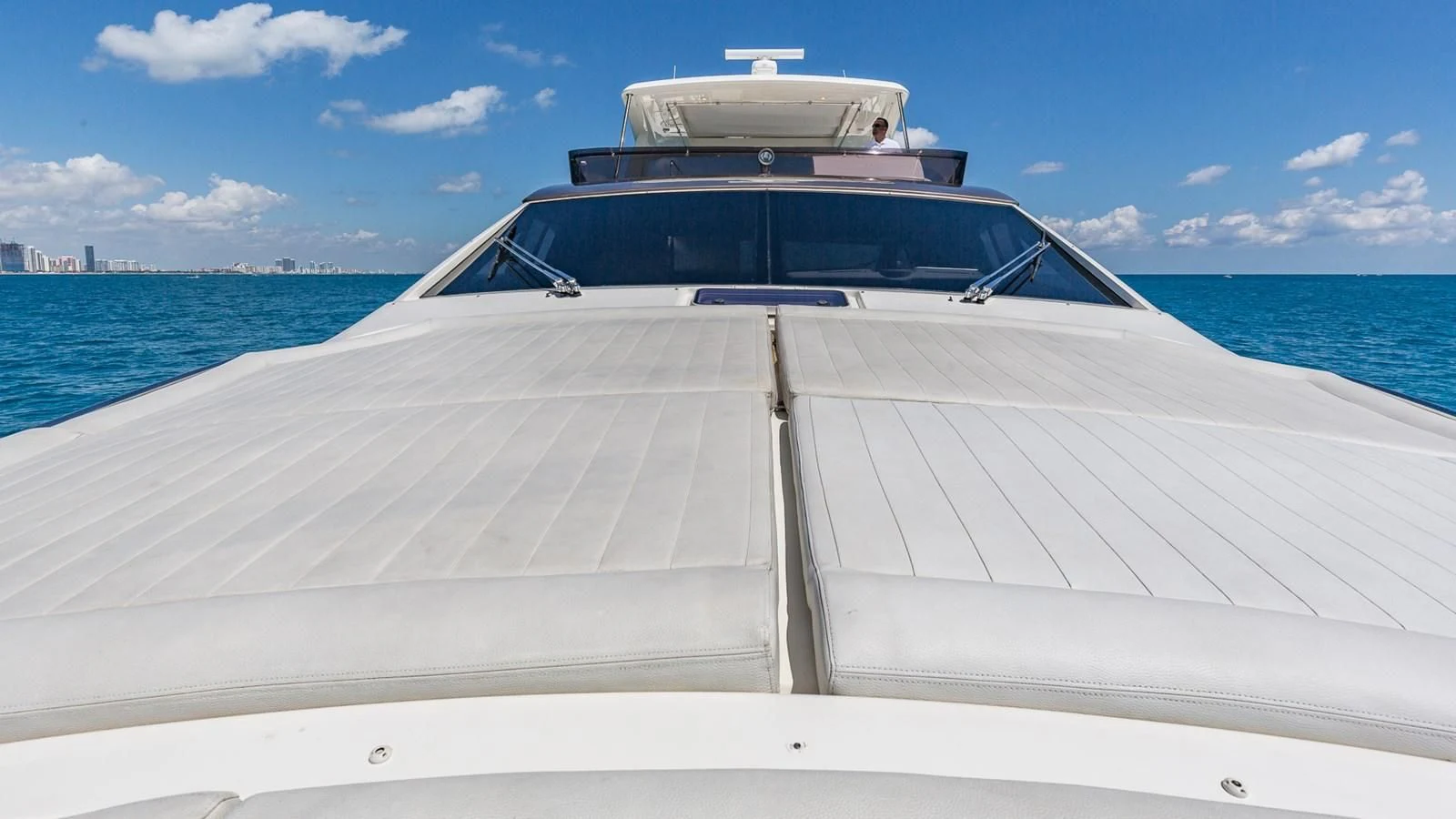 a white boat on a dock aboard GOLDEN BELLE Yacht for Sale