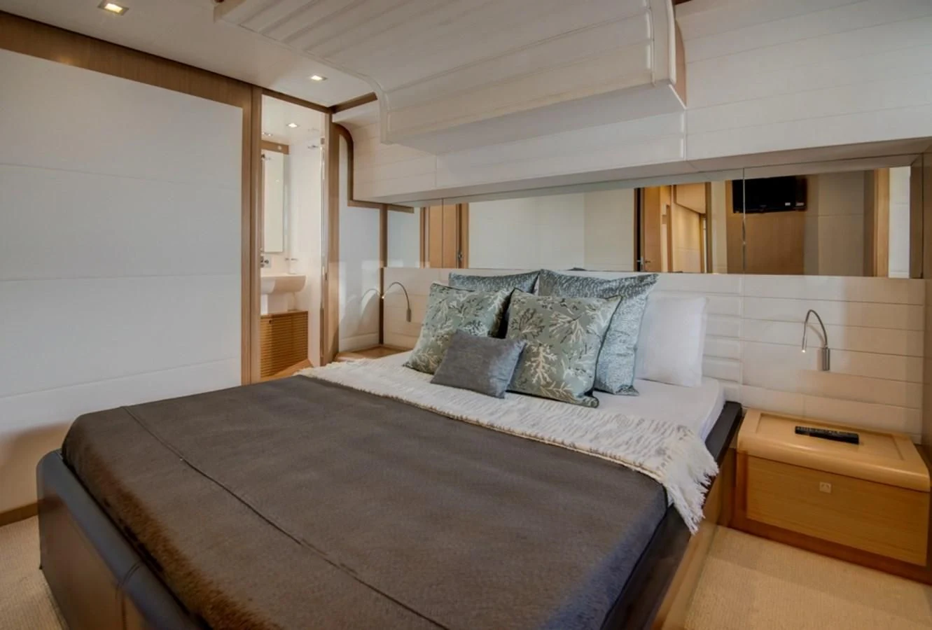 a bed in a room aboard GOLDEN BELLE Yacht for Sale