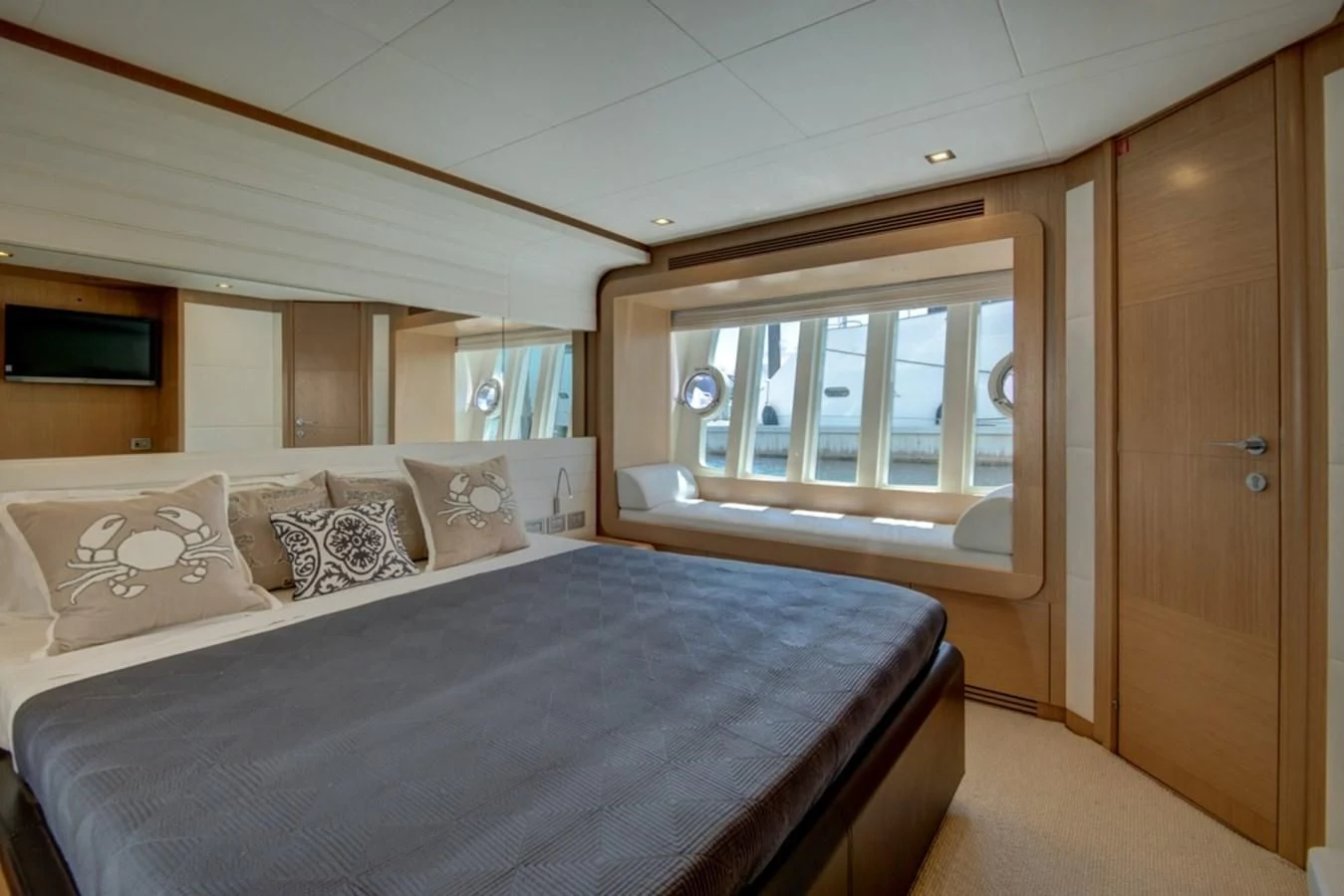 a bed with a blue sheet aboard GOLDEN BELLE Yacht for Sale