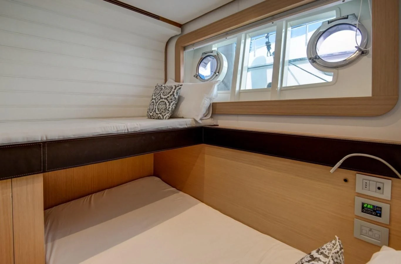 a room with a bed and a window aboard GOLDEN BELLE Yacht for Sale
