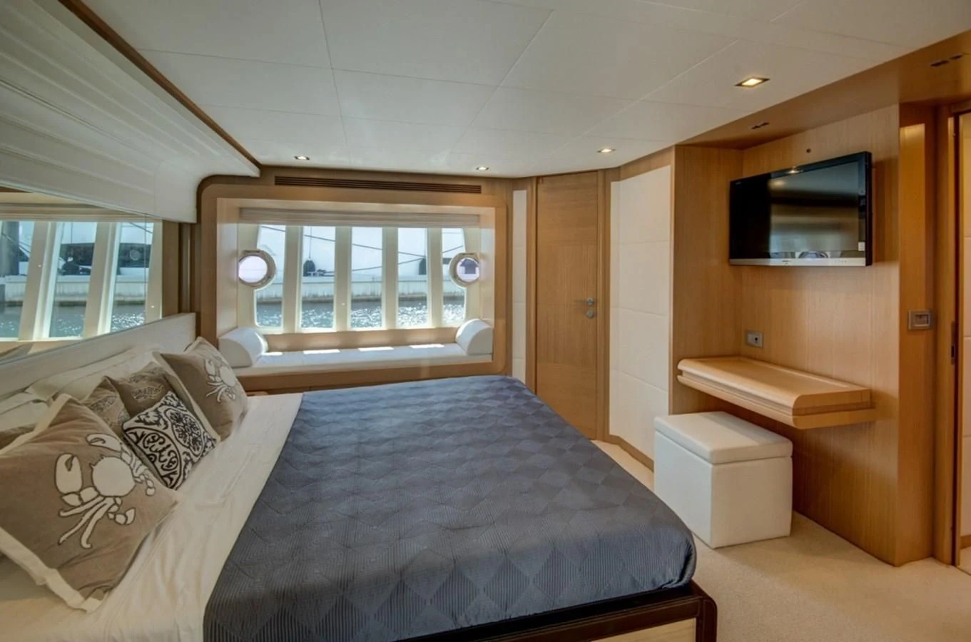 a bedroom with a bed and a tv aboard GOLDEN BELLE Yacht for Sale