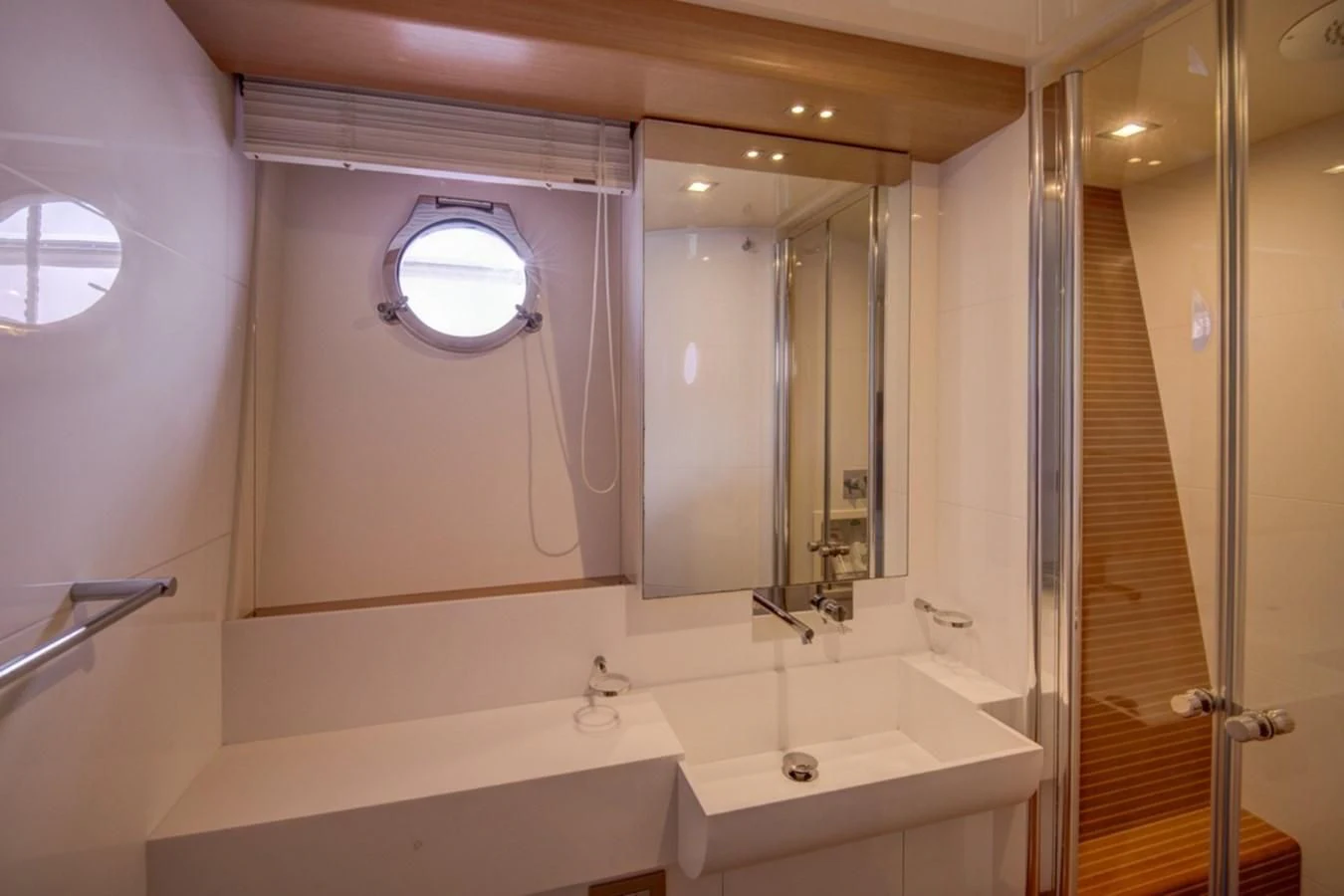 a bathroom with a large mirror aboard GOLDEN BELLE Yacht for Sale