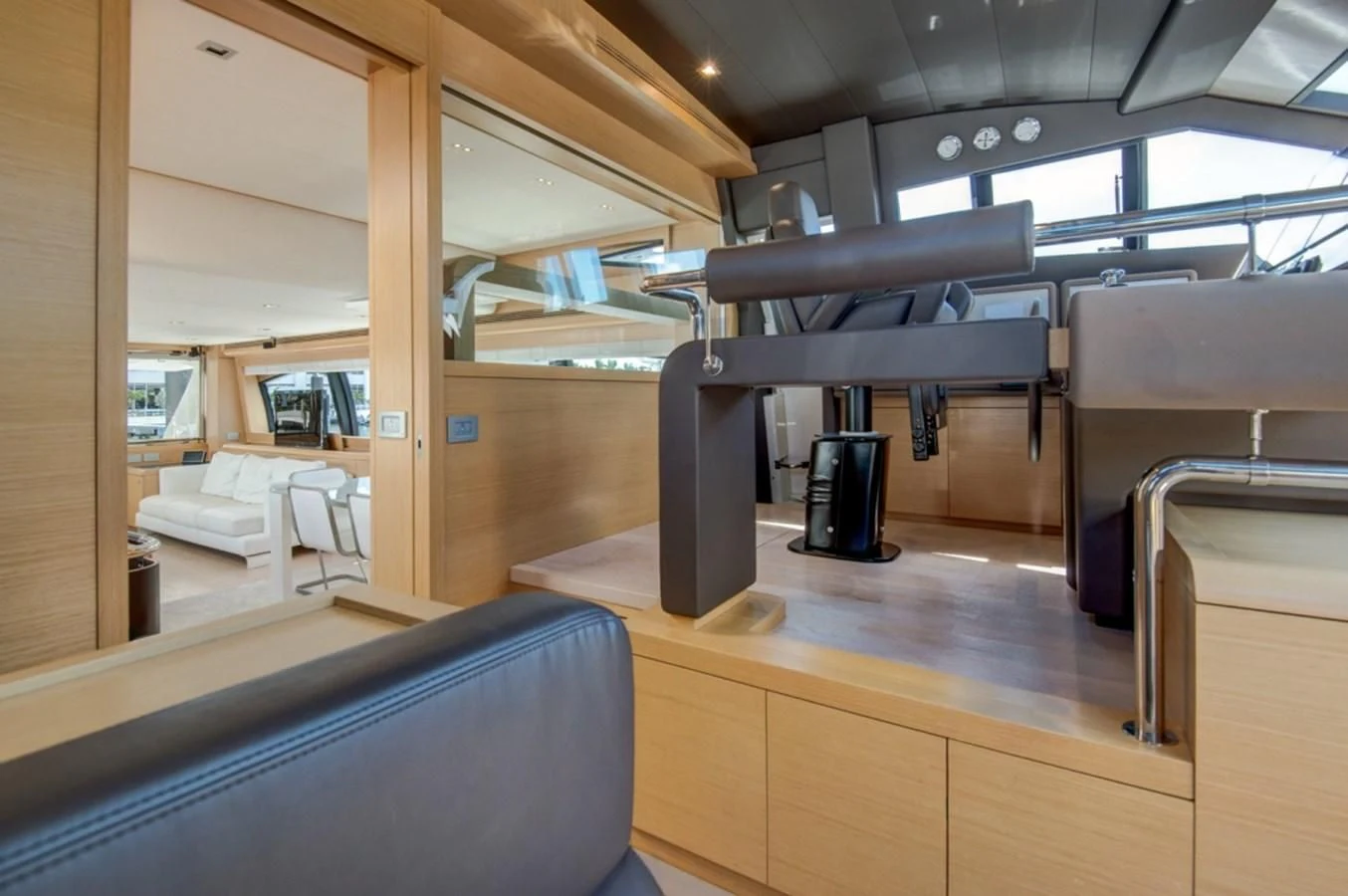 a room with a desk and chairs aboard GOLDEN BELLE Yacht for Sale