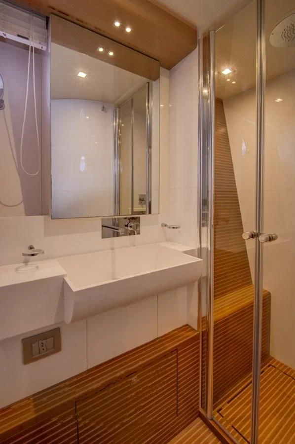 a bathroom with a large mirror aboard GOLDEN BELLE Yacht for Sale