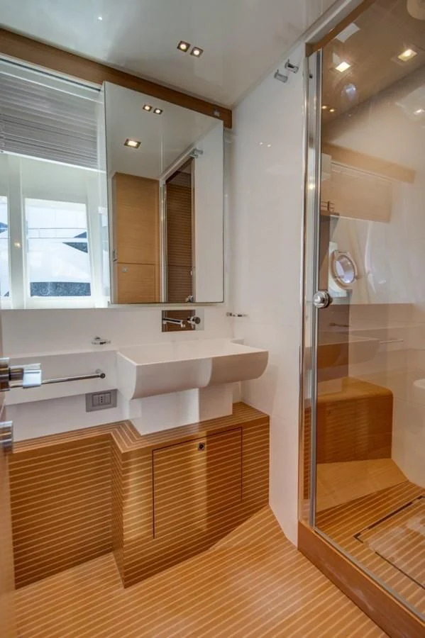 a bathroom with a sink and a shower unit aboard GOLDEN BELLE Yacht for Sale