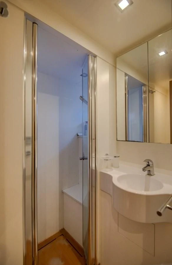 a bathroom with a sink and a mirror aboard GOLDEN BELLE Yacht for Sale