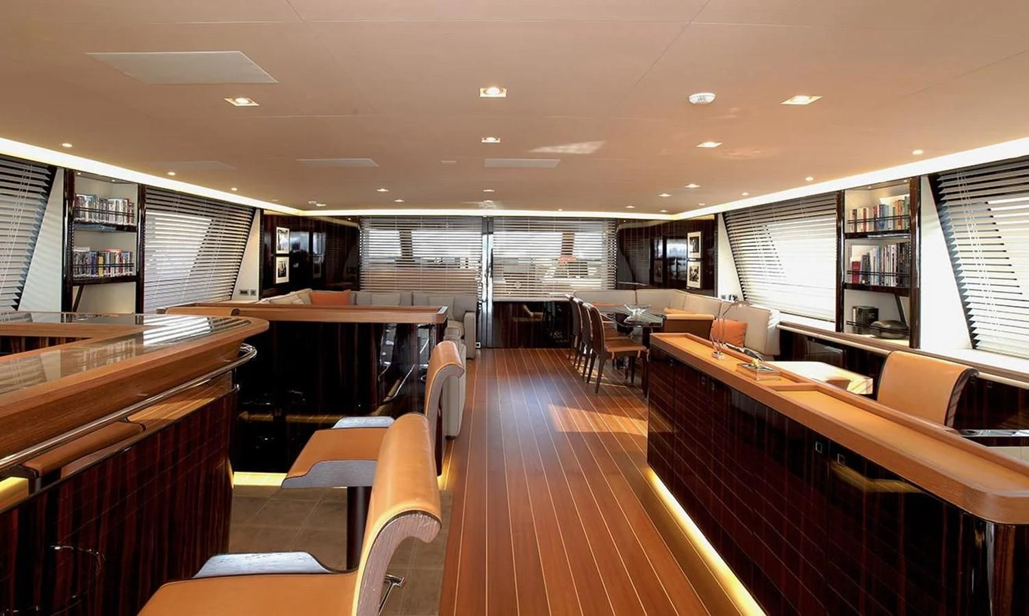 a room with wooden floors and wood furniture aboard SERENDIPITY I Yacht for Charter
