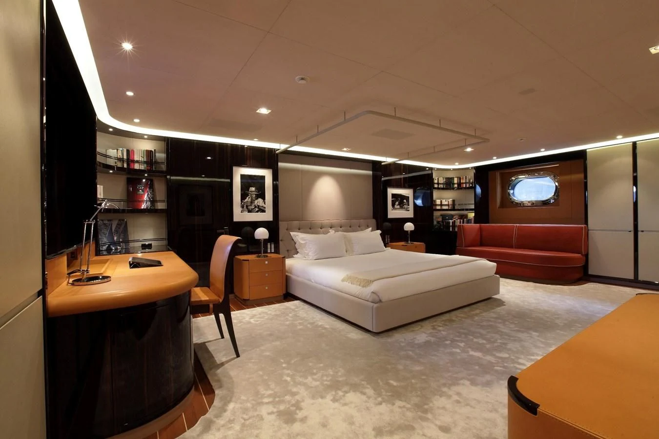 a room with a bed and a desk aboard SERENDIPITY I Yacht for Charter