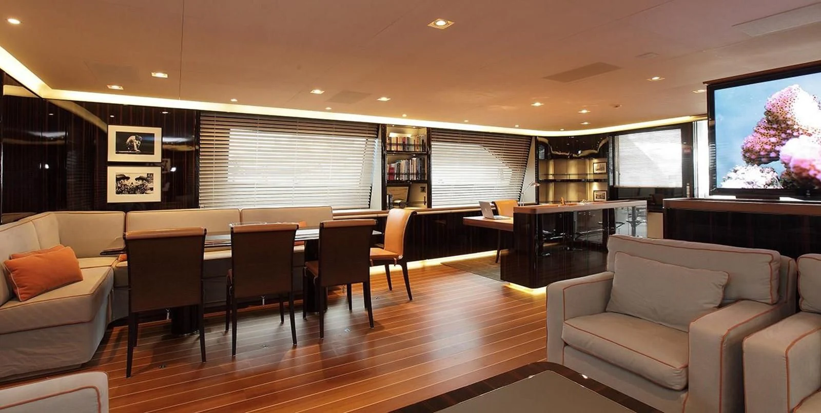 a large room with a table and chairs aboard SERENDIPITY I Yacht for Charter