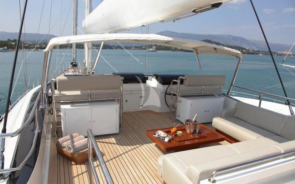 a boat with a table and chairs on the deck aboard SERENDIPITY I Yacht for Charter