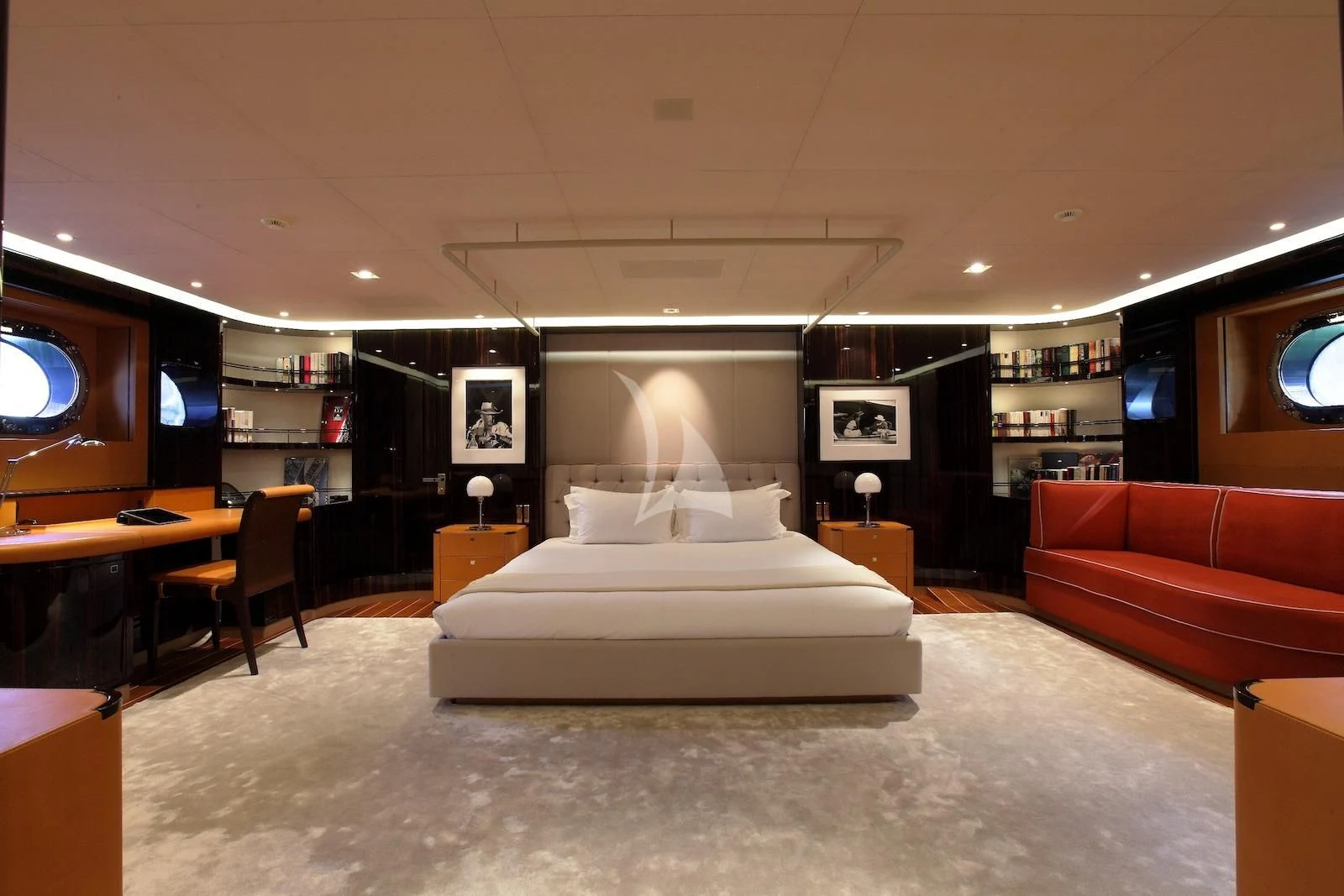 a large room with a couch and a tv aboard SERENDIPITY I Yacht for Charter