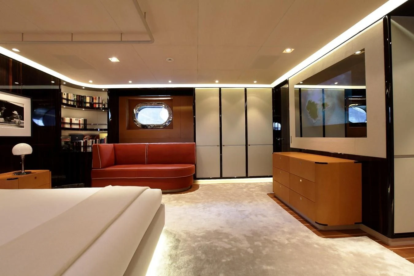 a room with a couch and a tv aboard SERENDIPITY I Yacht for Charter