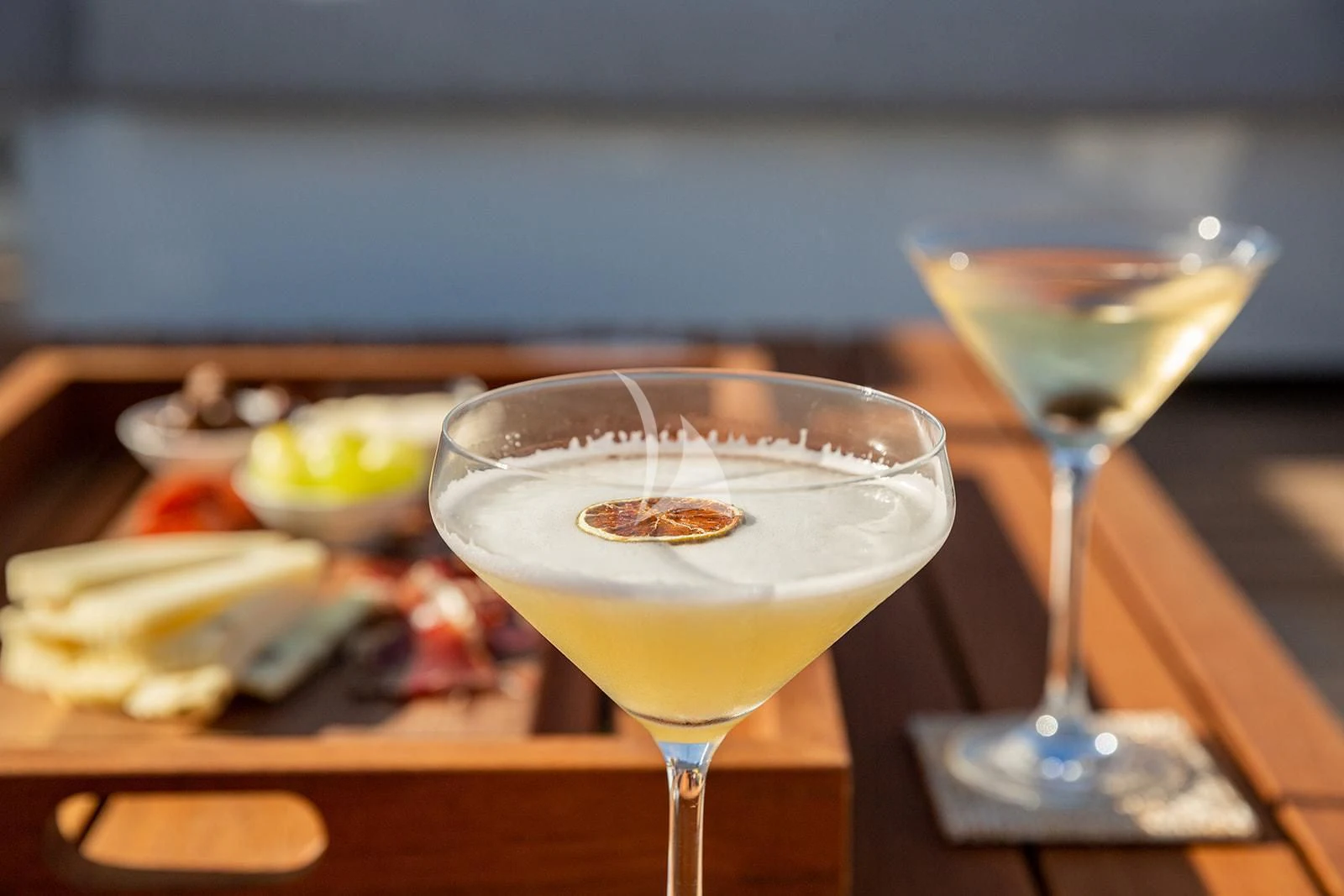 a couple of glasses of wine on a table aboard SERENDIPITY I Yacht for Charter
