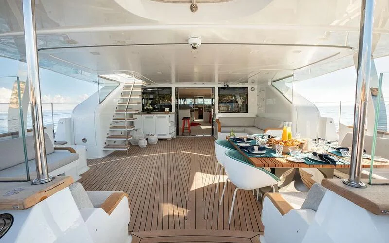 inside of a room with a large window and a staircase aboard SERENDIPITY I Yacht for Charter
