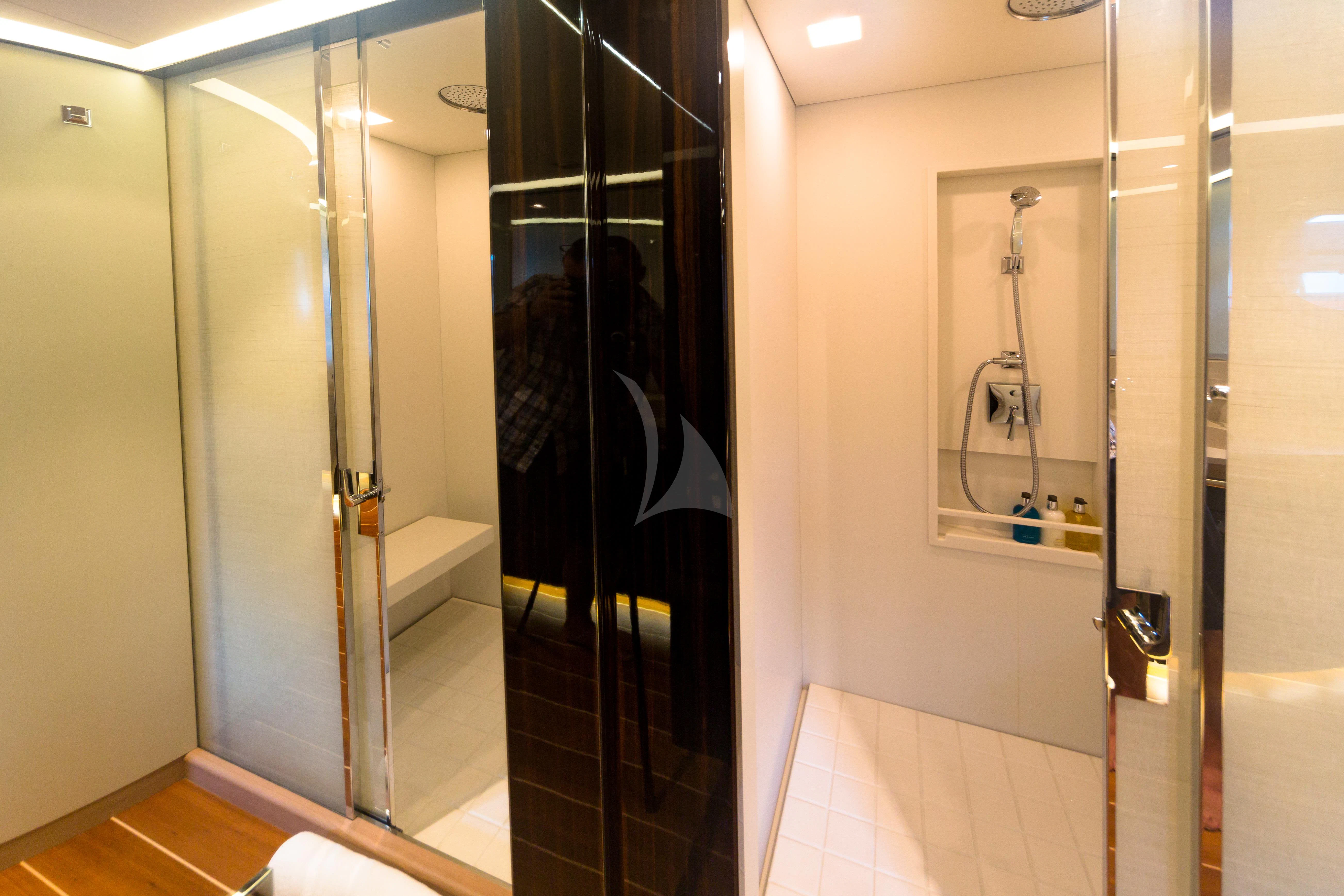 a bathroom with a glass shower aboard SERENDIPITY I Yacht for Charter