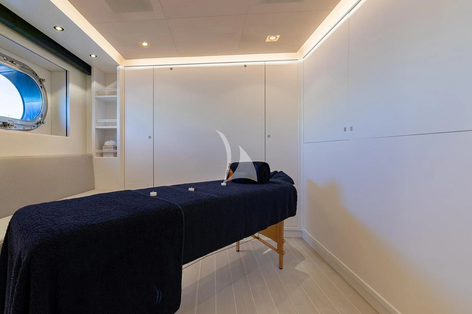 a room with a bed and a window aboard SERENDIPITY I Yacht for Charter