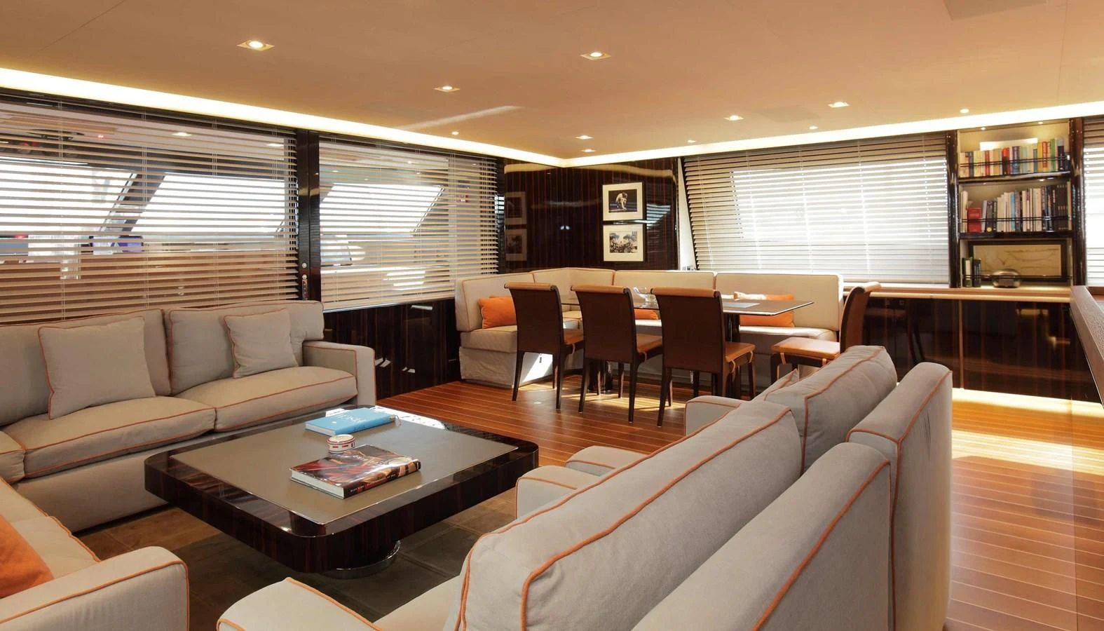 a room with couches and tables aboard SERENDIPITY I Yacht for Charter