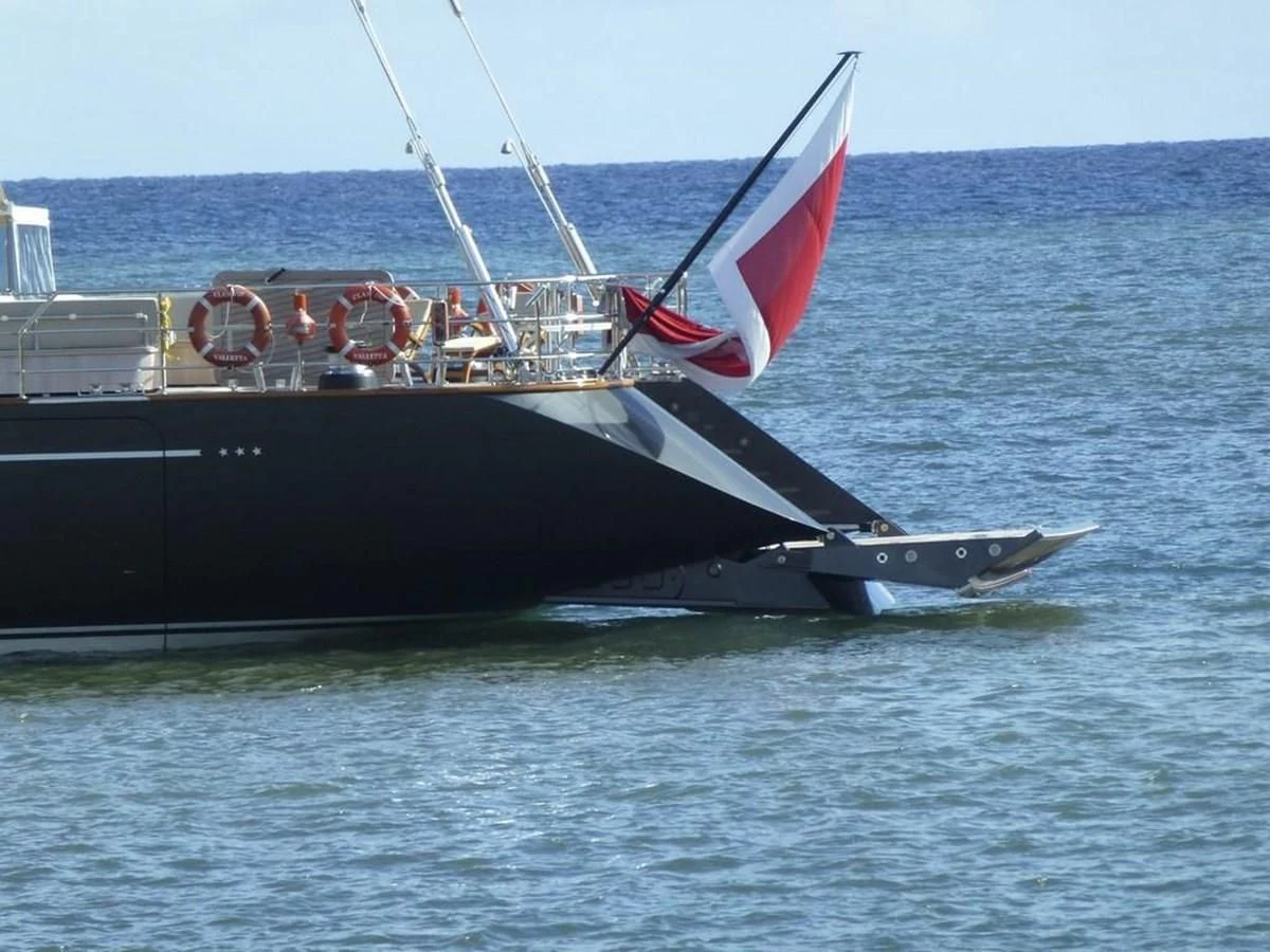 a large black and red sailboat aboard SERENDIPITY I Yacht for Charter