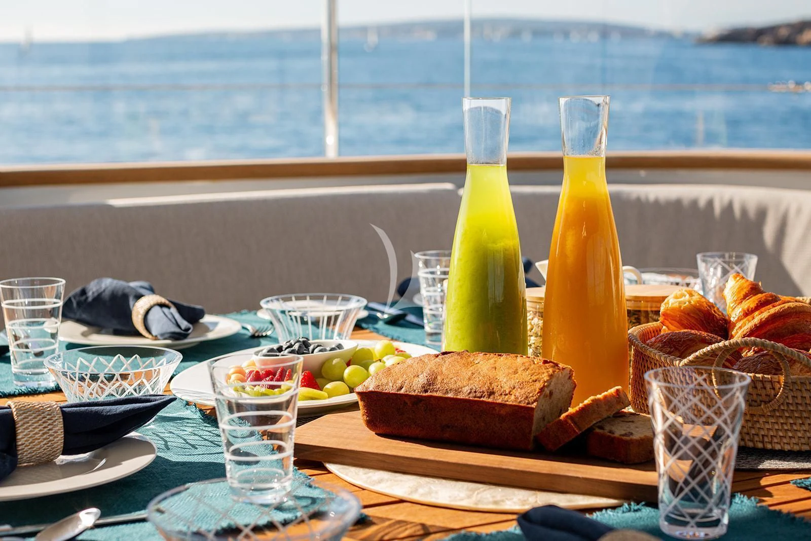 a table with food and drinks aboard SERENDIPITY I Yacht for Charter