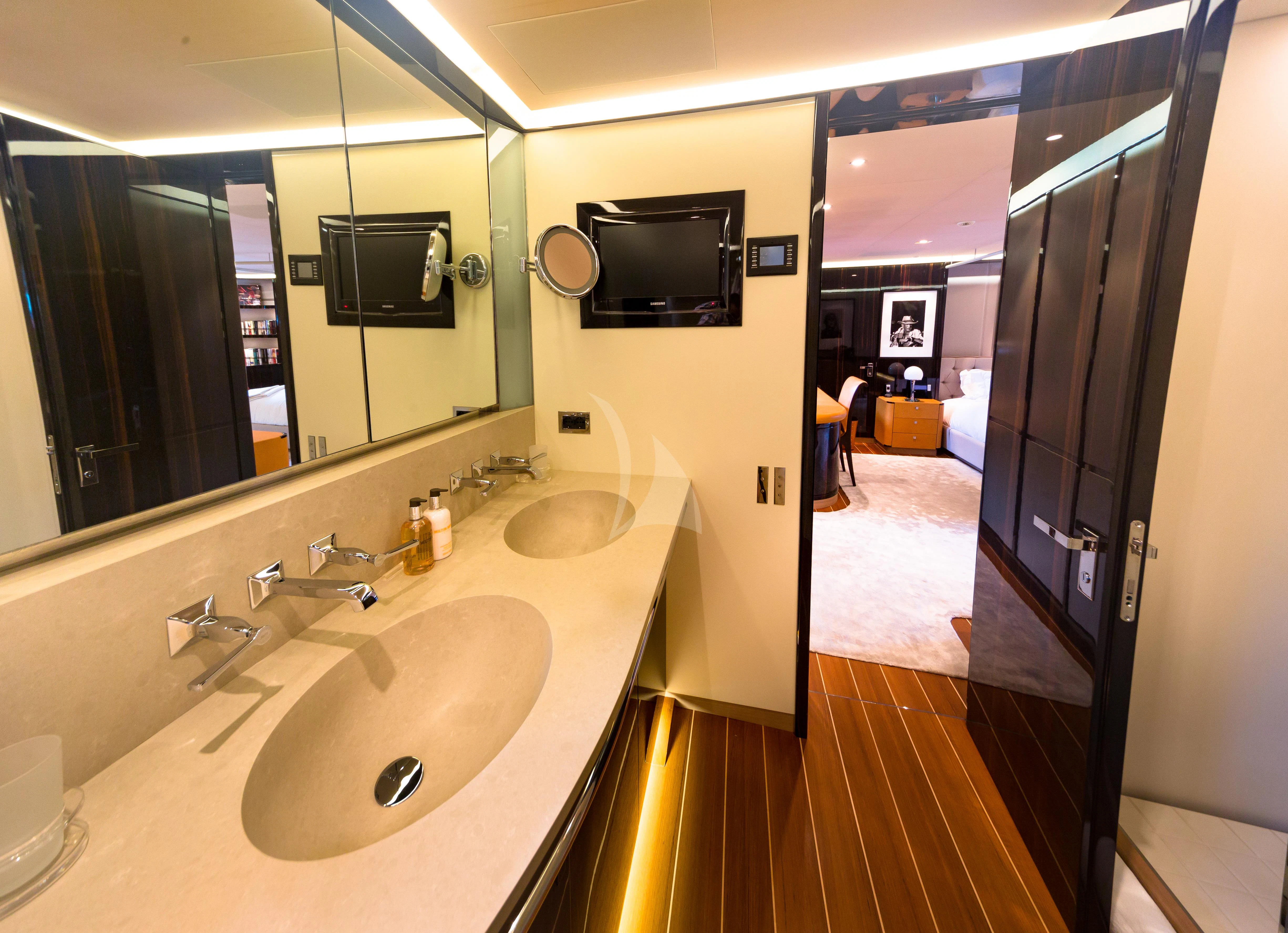 a bathroom with a sink and a mirror aboard SERENDIPITY I Yacht for Charter