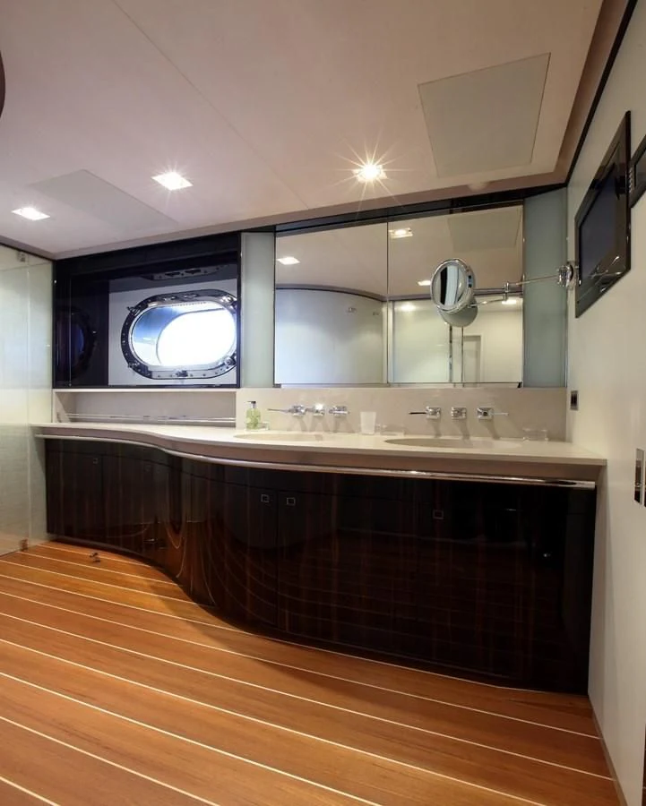 a large bathroom with a large mirror aboard SERENDIPITY I Yacht for Charter