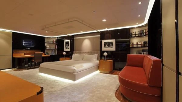 a large room with a couch and a tv aboard SERENDIPITY I Yacht for Charter