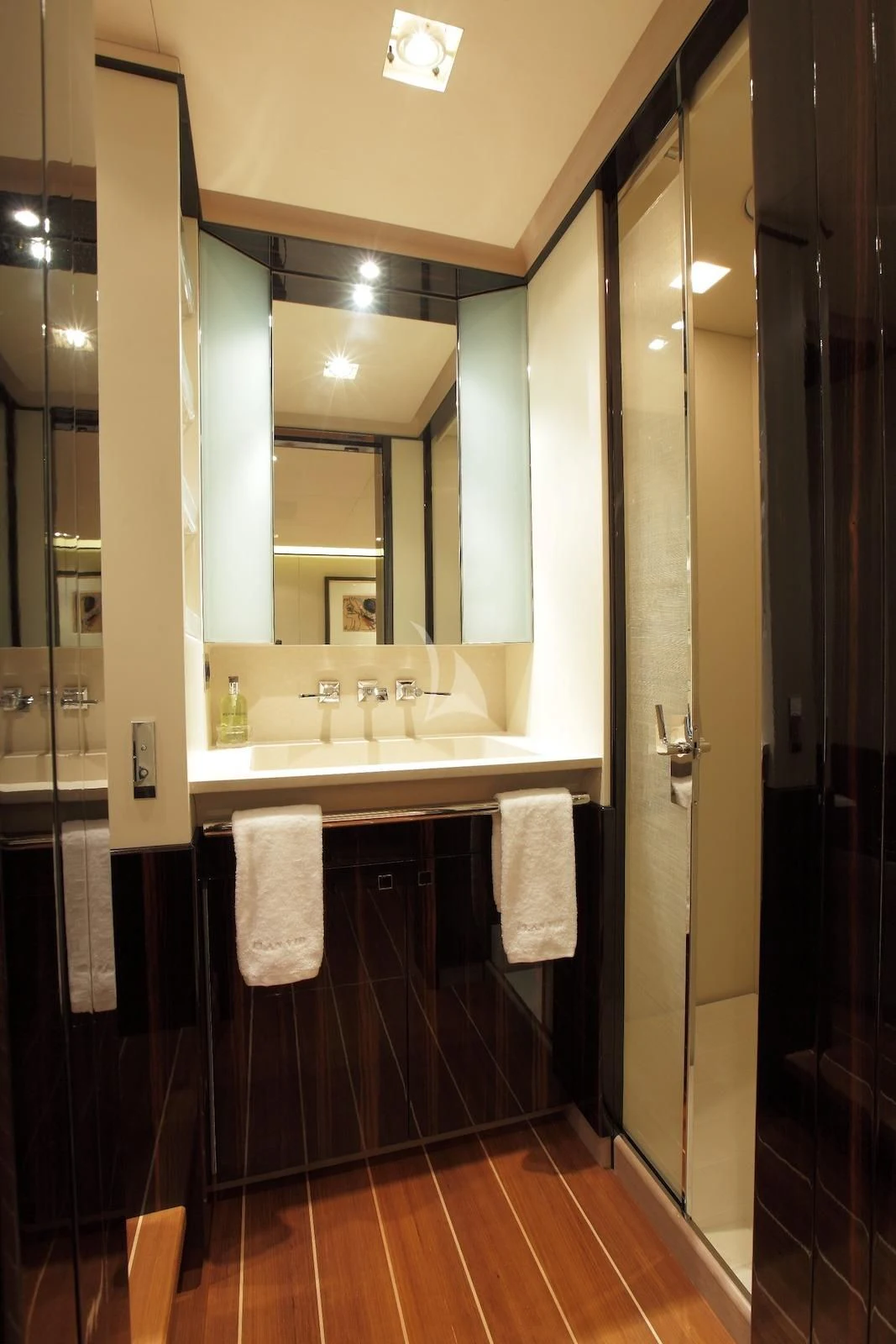 a bathroom with a large mirror aboard SERENDIPITY I Yacht for Charter